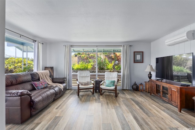 46-146 Hinalani Pl, Kaneohe, HI 96744 - living area featuring a wall mounted AC, light wood-style floors, and plenty of natural light