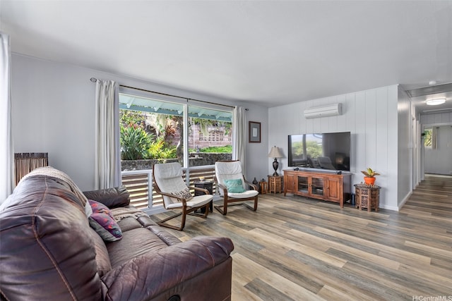 46-146 Hinalani Pl, Kaneohe, HI 96744 - living room with wood finished floors, an AC wall unit, and healthy amount of natural light
