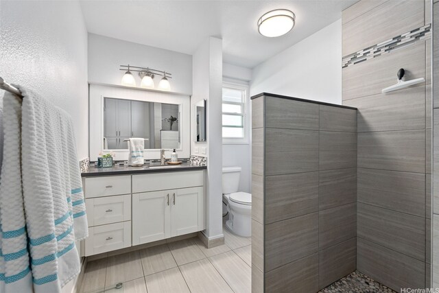 46-146 Hinalani Pl, Kaneohe, HI 96744 - bathroom with vanity, tiled shower, and tile patterned floors