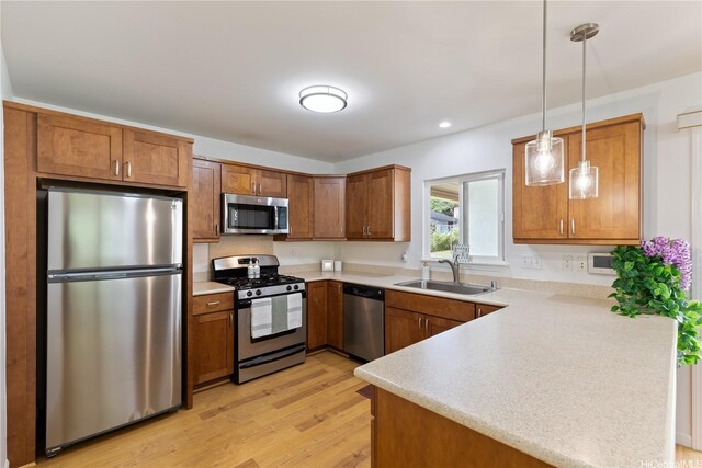 95-246 Wailawa St, Mililani, HI 96789 - kitchen with stainless steel appliances, brown cabinets, light countertops, and recessed lighting