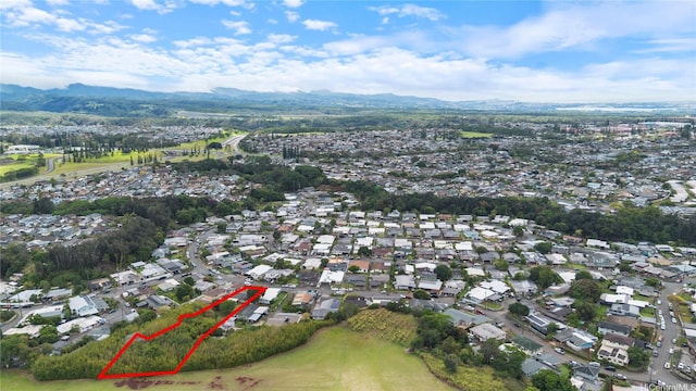 95-246 Wailawa St, Mililani, HI 96789 - aerial overview of property's location with a mountain backdrop, nearby suburban area, and property boundaries highlighted