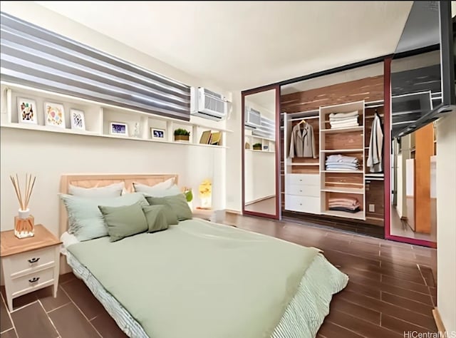 2092 Kuhio Ave Unit 805, Honolulu, HI 96815 - bedroom with a wall unit AC and wood finished floors