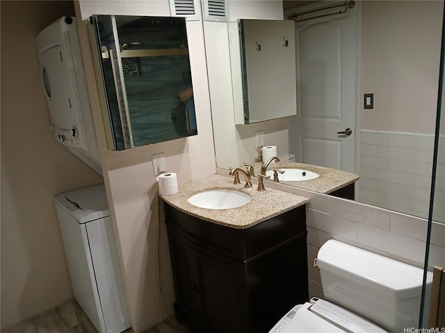 2092 Kuhio Ave Unit 805, Honolulu, HI 96815 - half bath with vanity and stacked washer / dryer