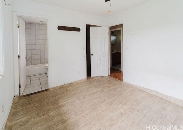 73-4154 Kahauli Pl, Kailua Kona, HI 96740 - unfurnished bedroom featuring ensuite bath and wood finished floors