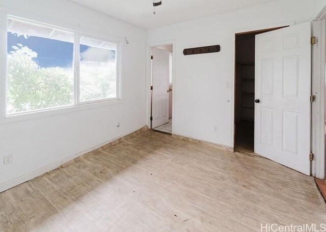 73-4154 Kahauli Pl, Kailua Kona, HI 96740 - unfurnished bedroom featuring wood finished floors and ceiling fan