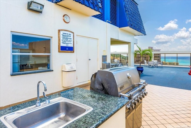 400 Hobron Ln Unit 603, Honolulu, HI 96815 - view of patio featuring exterior kitchen and a water view