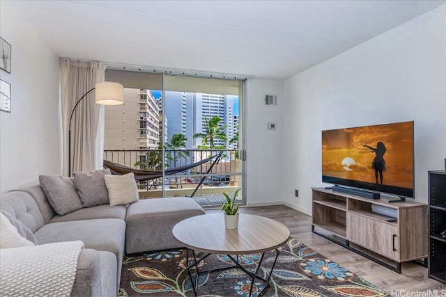 400 Hobron Ln Unit 603, Honolulu, HI 96815 - living area with wood finished floors and expansive windows