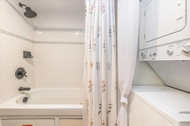 400 Hobron Ln Unit 603, Honolulu, HI 96815 - bathroom featuring stacked washer / drying machine and shower / bath combo with shower curtain