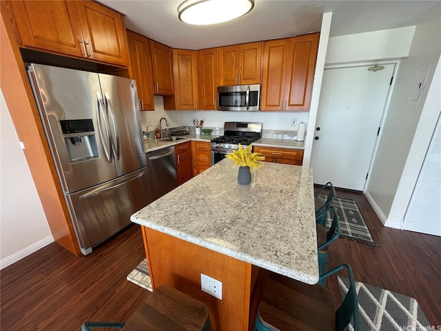 475 Atkinson Dr Unit 1909, Honolulu, HI 96814 - kitchen with stainless steel appliances, dark wood-style flooring, light stone countertops, and brown cabinets