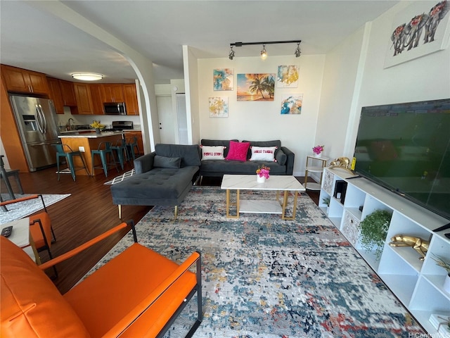 475 Atkinson Dr Unit 1909, Honolulu, HI 96814 - living area with arched walkways, rail lighting, and wood finished floors