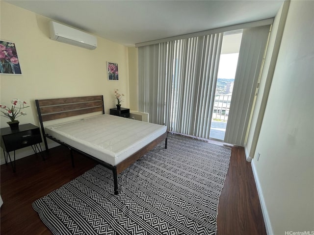 475 Atkinson Dr Unit 1909, Honolulu, HI 96814 - bedroom featuring a wall mounted AC and wood finished floors