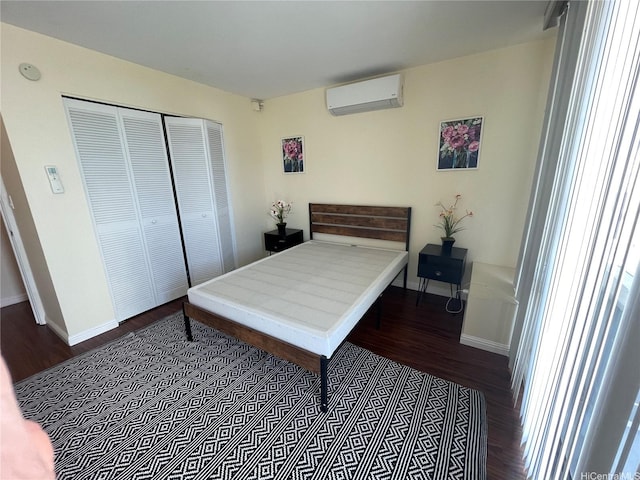 475 Atkinson Dr Unit 1909, Honolulu, HI 96814 - bedroom with a wall unit AC, wood finished floors, and a closet