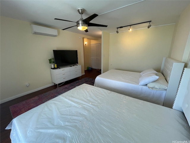 475 Atkinson Dr Unit 1909, Honolulu, HI 96814 - bedroom featuring a wall mounted air conditioner, rail lighting, wood finished floors, and a ceiling fan