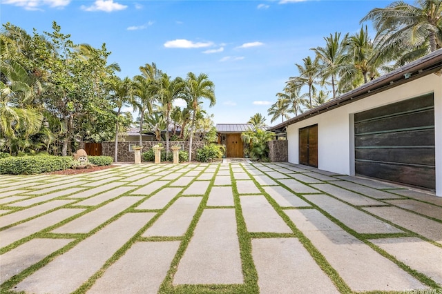 47 Kailuana Pl, Kailua, HI 96734 - view of patio featuring a garage and driveway