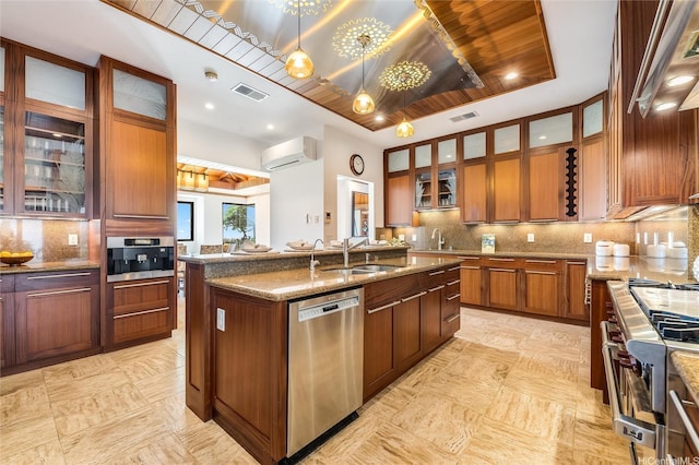 47 Kailuana Pl, Kailua, HI 96734 - kitchen with appliances with stainless steel finishes, a wall mounted AC, a center island with sink, light stone counters, and decorative backsplash