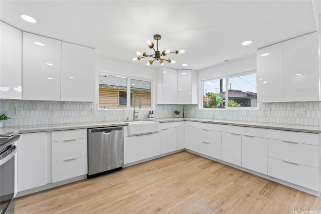 115A Makaweo St, Wahiawa, HI 96786 - kitchen featuring dishwasher, modern cabinets, white cabinetry, a chandelier, and decorative backsplash