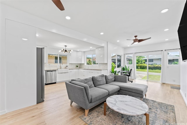 115A Makaweo St, Wahiawa, HI 96786 - living area featuring a ceiling fan, light wood-type flooring, a chandelier, and recessed lighting