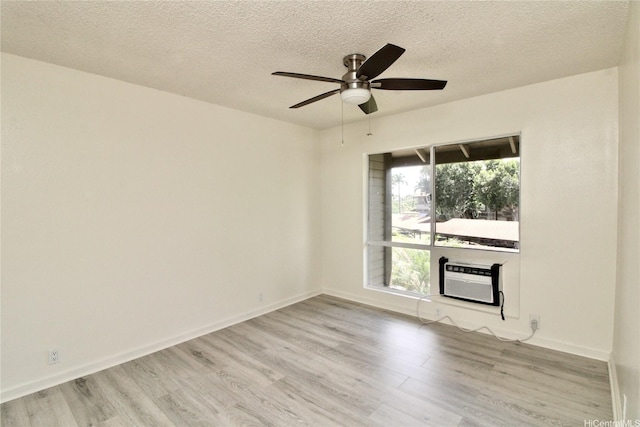 91-1180 Puamaeole St Unit 10T, Ewa Beach, HI 96706 - unfurnished room with a ceiling fan, wood finished floors, a textured ceiling, and an AC wall unit