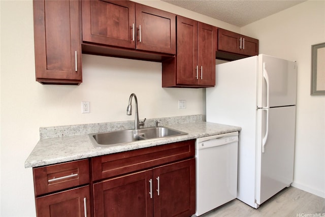 91-1180 Puamaeole St Unit 10T, Ewa Beach, HI 96706 - kitchen with white appliances, light countertops, and light wood-style flooring