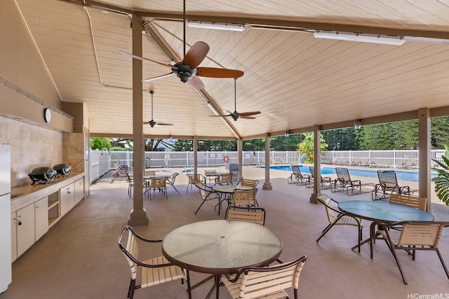 46-081 Konohiki St Unit 3533, Kaneohe, HI 96744 - fenced backyard featuring a community pool, exterior kitchen, ceiling fan, and a patio area
