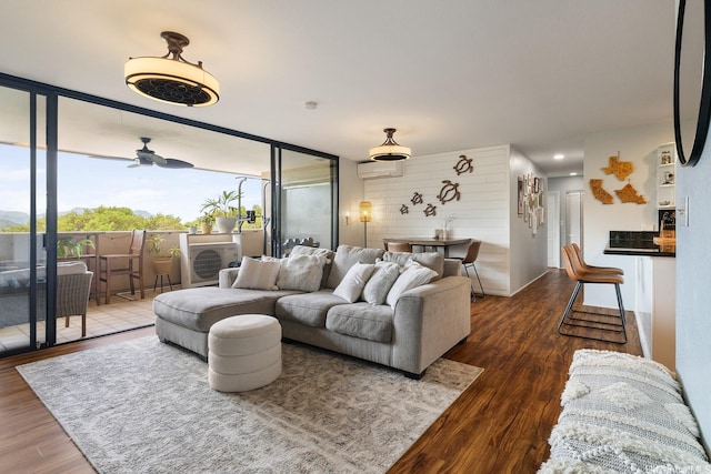 46-081 Konohiki St Unit 3533, Kaneohe, HI 96744 - living area featuring wood finished floors, an AC wall unit, and ceiling fan