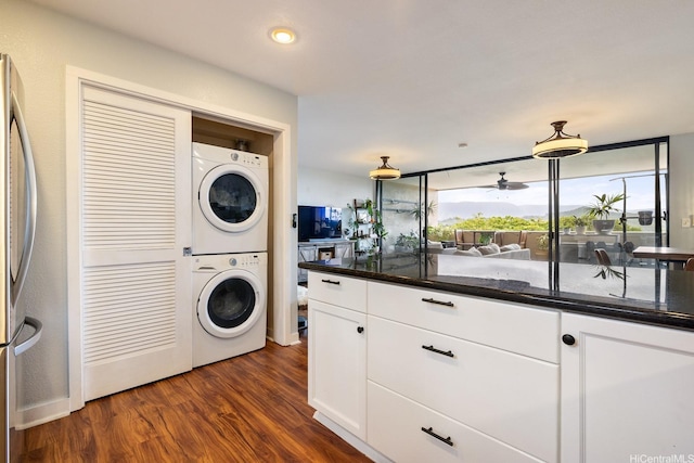 46-081 Konohiki St Unit 3533, Kaneohe, HI 96744 - laundry room featuring estacked washer and dryer, dark wood-type flooring, and ceiling fan