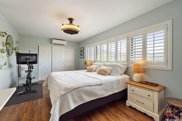 46-081 Konohiki St Unit 3533, Kaneohe, HI 96744 - bedroom with a wall mounted AC, a closet, and dark wood-style flooring