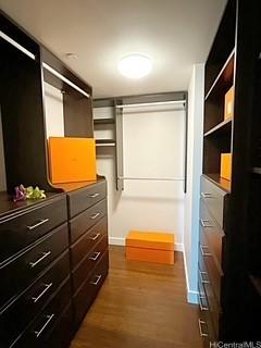 1177 Queen St Unit 2302, Honolulu, HI 96814 - walk in closet featuring dark wood-style floors