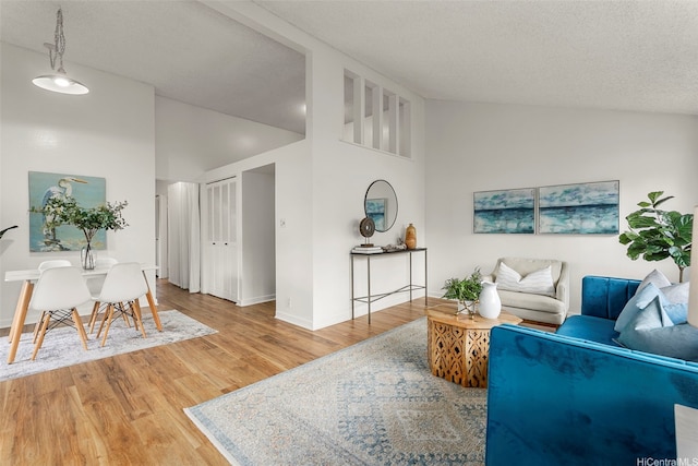 95-138 Kuahelani Ave Unit 244, Mililani, HI 96789 - living room featuring wood finished floors and lofted ceiling