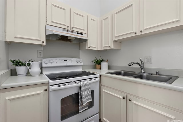 95-138 Kuahelani Ave Unit 244, Mililani, HI 96789 - kitchen with white range with electric cooktop, under cabinet range hood, light countertops, and white cabinetry