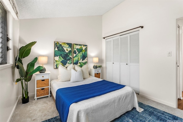 95-138 Kuahelani Ave Unit 244, Mililani, HI 96789 - carpeted bedroom with a closet, vaulted ceiling, and a textured ceiling