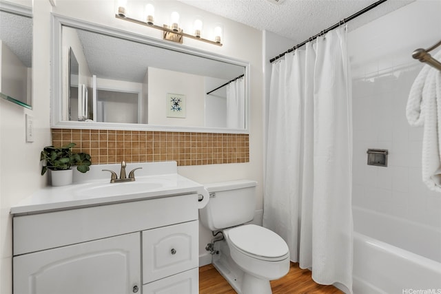 95-138 Kuahelani Ave Unit 244, Mililani, HI 96789 - bathroom with a textured ceiling, vanity, decorative backsplash, wood finished floors, and shower / bath combination with curtain