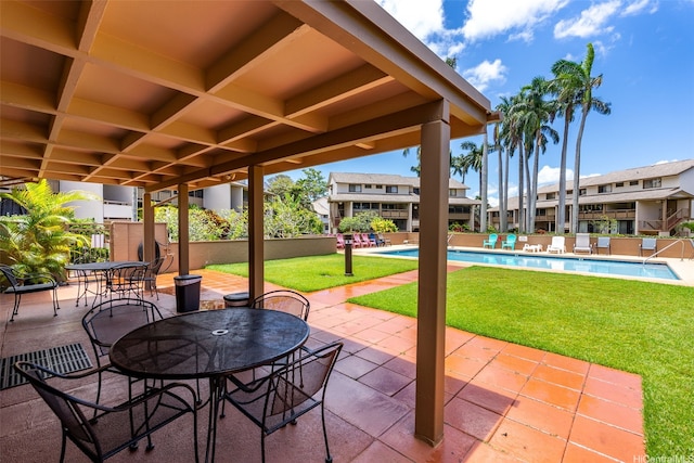 95-138 Kuahelani Ave Unit 244, Mililani, HI 96789 - view of patio / terrace featuring a community pool