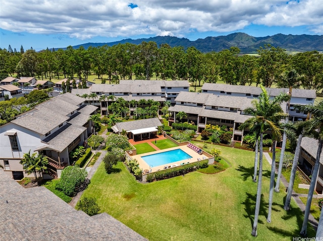 95-138 Kuahelani Ave Unit 244, Mililani, HI 96789 - aerial perspective of suburban area with a pool area and a mountainous background