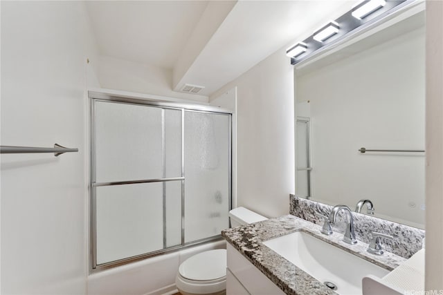469 Ena Rd Unit 1111, Honolulu, HI 96815 - bathroom featuring vanity and bath / shower combo with glass door