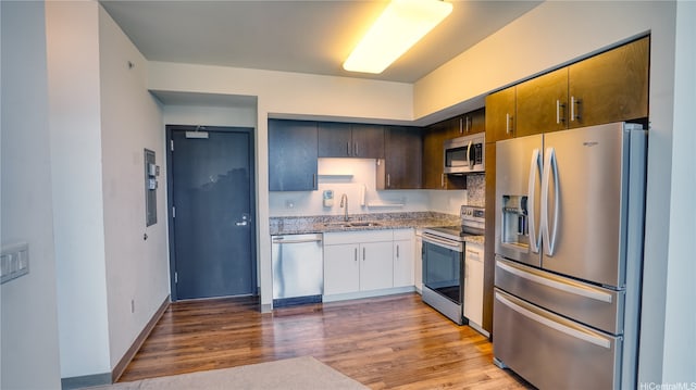 988 Halekauwila St Unit 4108, Honolulu, HI 96816 - kitchen with appliances with stainless steel finishes, wood finished floors, and light stone countertops