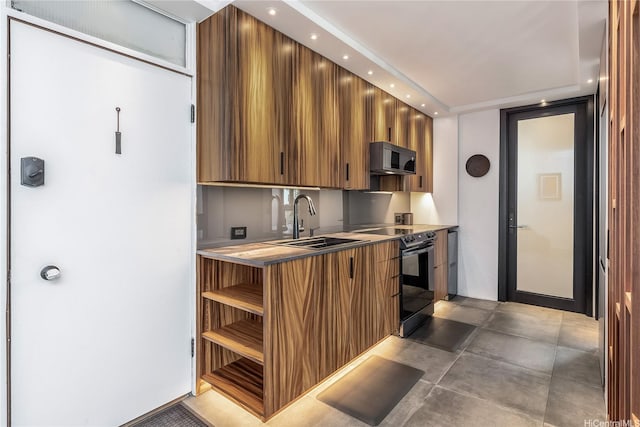 2987 Kalakaua Ave Unit 201, Honolulu, HI 96815 - kitchen with electric range, brown cabinets, modern cabinets, recessed lighting, and light countertops