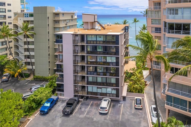 2987 Kalakaua Ave Unit 201, Honolulu, HI 96815 - view of apartment building / complex featuring uncovered parking and a water view