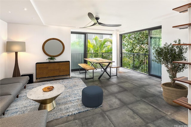 2987 Kalakaua Ave Unit 201, Honolulu, HI 96815 - living area with a ceiling fan, floor to ceiling windows, and concrete floors