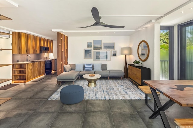 2987 Kalakaua Ave Unit 201, Honolulu, HI 96815 - living room featuring ceiling fan and concrete floors