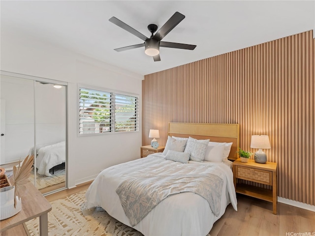 87-2204 Farrington Hwy Unit A, Waianae, HI 96792 - bedroom featuring a closet, light wood finished floors, a ceiling fan, and an accent wall