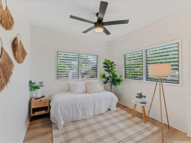87-2204 Farrington Hwy Unit A, Waianae, HI 96792 - bedroom with wood finished floors and a ceiling fan
