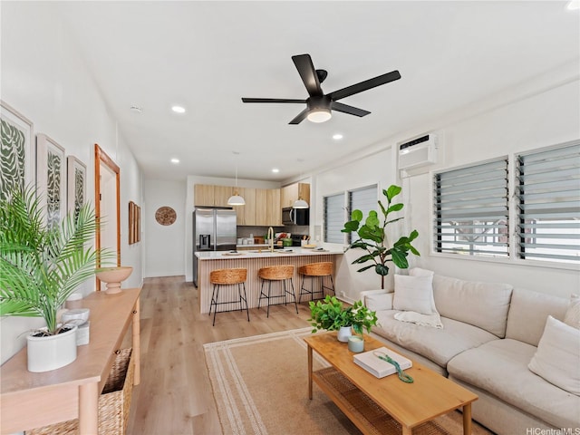 87-2204 Farrington Hwy Unit A, Waianae, HI 96792 - living room featuring a ceiling fan, light wood-type flooring, an AC wall unit, and recessed lighting
