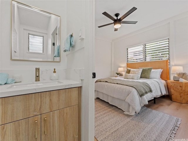 87-2204 Farrington Hwy Unit A, Waianae, HI 96792 - bedroom featuring multiple windows, wood finished floors, and a ceiling fan