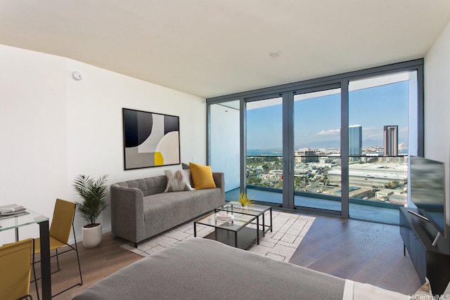 1000 Auahi St Unit 1805, Honolulu, HI 96814 - living room featuring a wall of windows and wood finished floors