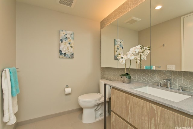 1000 Auahi St Unit 1805, Honolulu, HI 96814 - bathroom featuring decorative backsplash, vanity, and tile patterned flooring