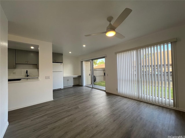91-1089 Puamaeole St Unit 15D, Ewa Beach, HI 96706 - unfurnished living room with a ceiling fan, dark wood-type flooring, and recessed lighting