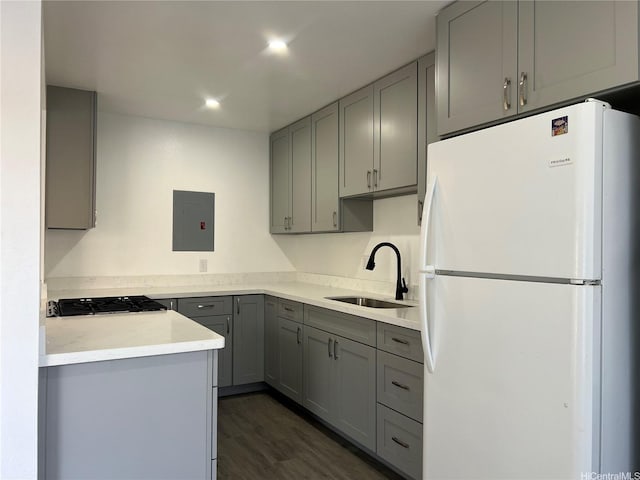 91-1089 Puamaeole St Unit 15D, Ewa Beach, HI 96706 - kitchen featuring freestanding refrigerator, gray cabinetry, electric panel, dark wood-style flooring, and light countertops