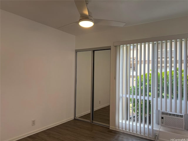 91-1089 Puamaeole St Unit 15D, Ewa Beach, HI 96706 - unfurnished bedroom with multiple windows, a closet, wood finished floors, and ceiling fan
