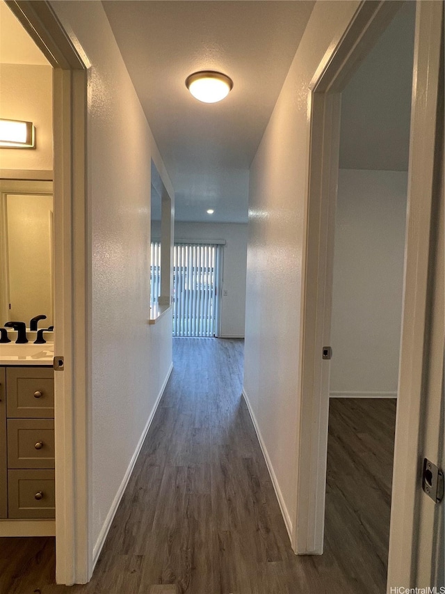 91-1089 Puamaeole St Unit 15D, Ewa Beach, HI 96706 - hallway with dark wood-type flooring and baseboards